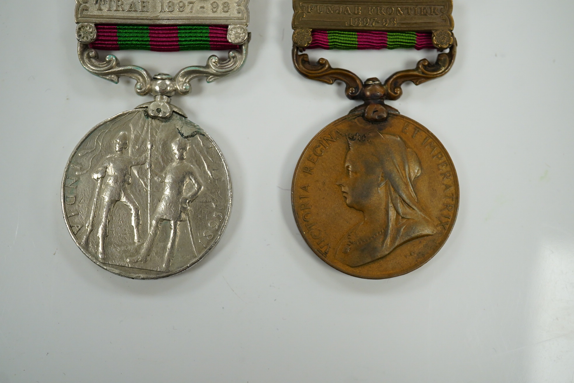 Two India Medals; one with Tirah 1897-98 clasp, naming worn/erased, the other in bronze with Punjab Frontier 1897-98 clasp to ...Transport Dept